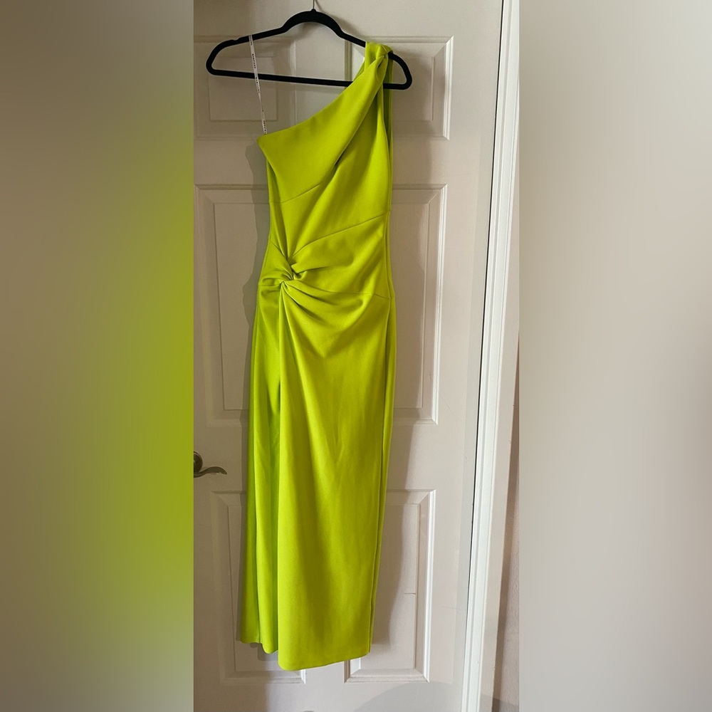 Marciano lime colored one shoulder gown with slit in the from leg